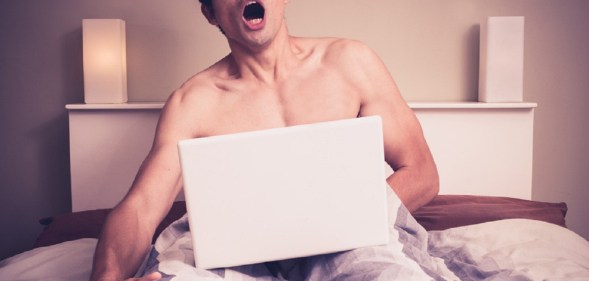 Man watchin porn on laptop
