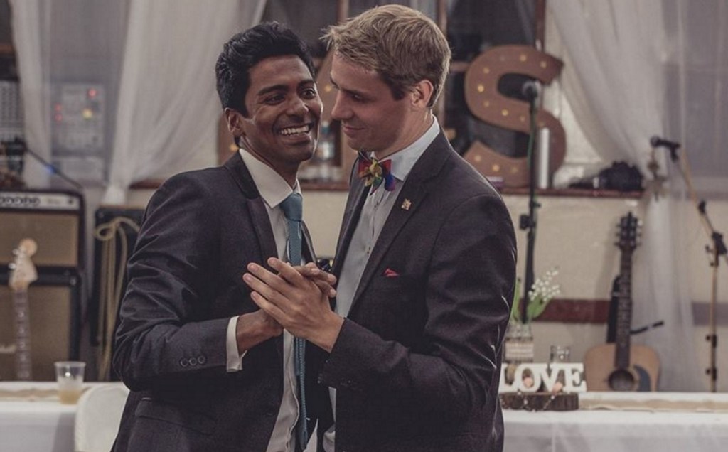 The grooms in Saint Helena's first gay wedding, Michael Wernstedt and Lemarc Thomas, dance in suits