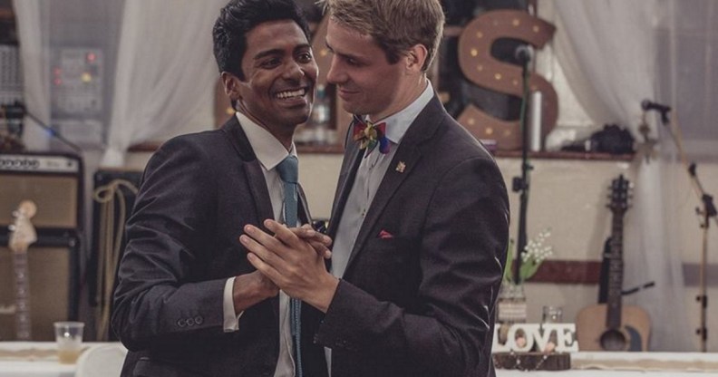 The grooms in Saint Helena's first gay wedding, Michael Wernstedt and Lemarc Thomas, dance in suits