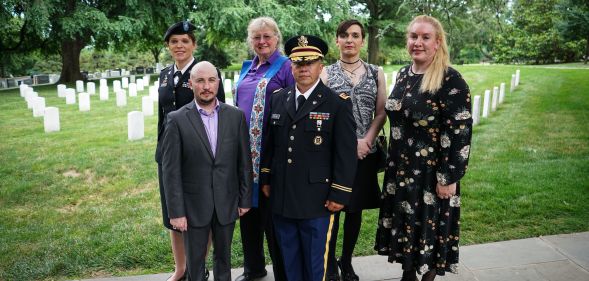 Transgender troops pose for a photo in Arlington National Cemetery, from left: retired Army lieutenant colonel Ann Murdoch, Transgender American Veterans Association Vice President Gene Silvestri, Yvonne Cook-Riley, retired Army major and Transgender American Veterans Association President Evan Young, petty officer first class Alice Ashton and retired Air Force major Nella Ludlow