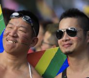 Participants pose at the square outside the presidential office before the start of a gay pride parade in Taipei, Taiwan on October 27, 2018.