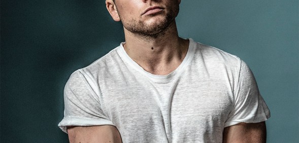 Taron Egerton wearing a white t-shirt