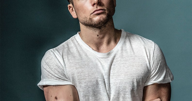 Taron Egerton wearing a white t-shirt