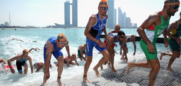 The Elite Men leave the water during the 2016 ITU World Triathlon Abu Dhabi on March 5, 2016 in Abu Dhabi, United Arab Emirates.
