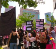 Protesters hold pro-equality signs and LGBT flags at the women's march in Malaysia