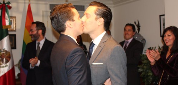 Gay Mexican couple share their first kiss after being pronounced married.