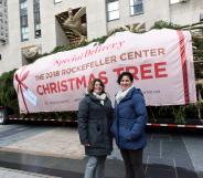 Lesbian couple Shirley Figueroa and Lissette Gutierrez pose with the Rockefeller Center tree they donated.