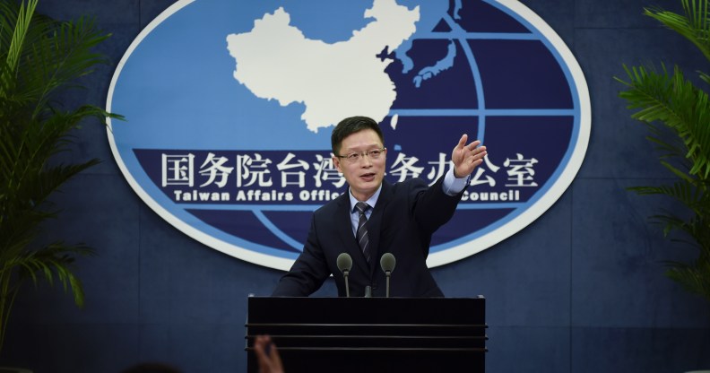 An Fengshan, spokesman for the State Council's Taiwan Affairs Office, gestures toward the media at a press conference in Beijing on December 28, 2016.