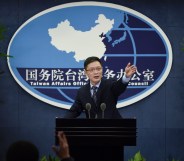 An Fengshan, spokesman for the State Council's Taiwan Affairs Office, gestures toward the media at a press conference in Beijing on December 28, 2016.