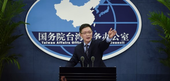 An Fengshan, spokesman for the State Council's Taiwan Affairs Office, gestures toward the media at a press conference in Beijing on December 28, 2016.