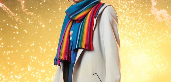 Jodie Whittaker as the Doctor in Doctor Who, wearing a rainbow scarf