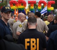 FBI agents keep watch during the 2016 Gay Pride Parade in West Hollywood, California on June 12, 2016.