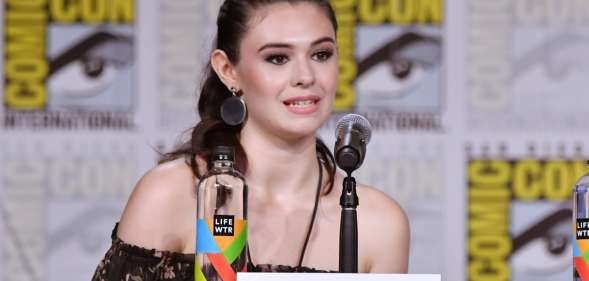 Nicole Maines walks onstage at the Supergirl Q&A during Comic-Con (Mike Coppola/Getty)