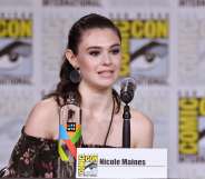 Nicole Maines walks onstage at the Supergirl Q&A during Comic-Con (Mike Coppola/Getty)