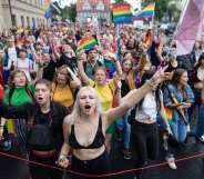 Participants of a gay pride parade walk through the streets of Poznan, August 11, 2018. (Photo by Wojtek RADWANSKI / AFP) (Photo credit should read WOJTEK RADWANSKI/AFP/Getty Images)