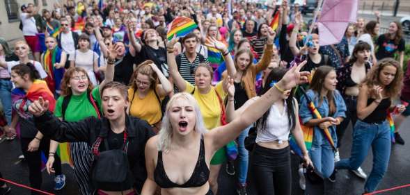 Participants of a gay pride parade walk through the streets of Poznan, August 11, 2018. (Photo by Wojtek RADWANSKI / AFP) (Photo credit should read WOJTEK RADWANSKI/AFP/Getty Images)
