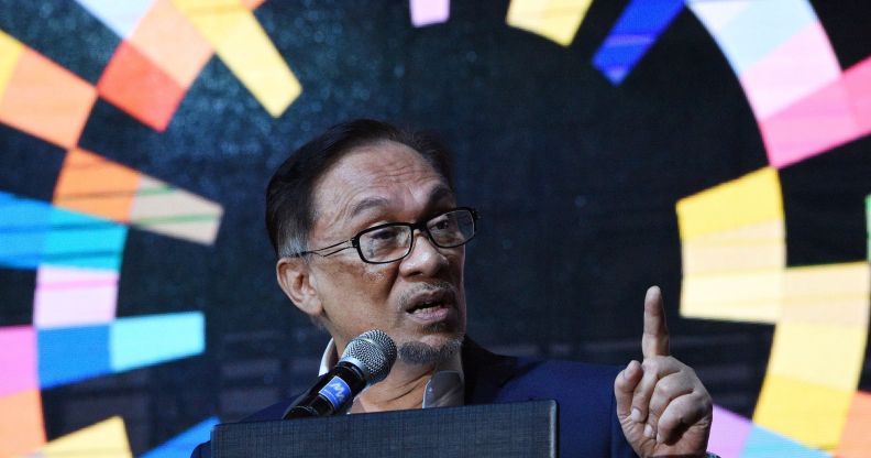 Malaysia's former deputy prime minister Anwar Ibrahim delivers a speech during a CEO conference organised by a local management association in Manila on September 4, 2018. - Anwar was jailed in 2015 on sodomy charges that critics say were politically motivated and then released in May 2018 after then-Prime Minister Najib Razak's election defeat. (Photo by TED ALJIBE / AFP) (Photo credit should read TED ALJIBE/AFP/Getty Images)