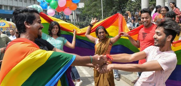 Indian members and supporters of the LGBT community celebrate the Supreme Court decision to strike down a colonial-era ban on gay sex, in Bangalore on September 6, 2018. (MANJUNATH KIRAN/AFP/Getty Images)