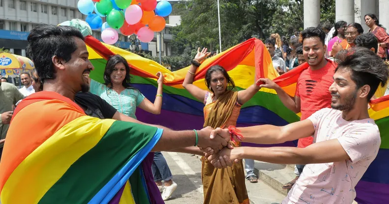 Indian members and supporters of the LGBT community celebrate the Supreme Court decision to strike down a colonial-era ban on gay sex, in Bangalore on September 6, 2018. (MANJUNATH KIRAN/AFP/Getty Images)