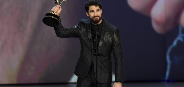 LOS ANGELES, CA - SEPTEMBER 17: Darren Criss accepts the Outstanding Lead Actor in a Limited Series or Movie award for 'The Assassination of Gianni Versace: American Crime Story' onstage during the 70th Emmy Awards at Microsoft Theater on September 17, 2018 in Los Angeles, California. (Photo by Kevin Winter/Getty Images)