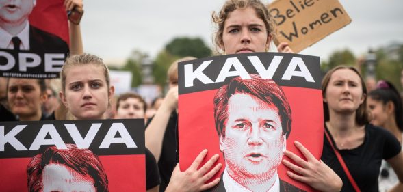 TOPSHOT - Women demonstrators protest against the appointment of Supreme Court nominee Brett Kavanaugh at the US Capitol in Washington DC, on October 6, 2018. - The US Senate confirmed conservative judge Kavanaugh as the next Supreme Court justice on October 6, offering US President Donald Trump a big political win and tilting the nation's high court decidedly to the right. (Photo by ROBERTO SCHMIDT / AFP) (Photo credit should read ROBERTO SCHMIDT/AFP/Getty Images)