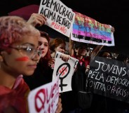 Demonstrators take part in a protest against Brazilian right-wing presidential candidate Jair Bolsonaro in Sao Paulo, Brazil, on October 10 2018. - The populist ultra-conservative won 46 percent of the vote in the first round, despite detractors highlighting his contentious past comments demeaning women and gays, and speaking in favor of torture and Brazil's 1964-1985 military dictatorship. Brazil will hold the run-off presidential election next October 28. (Photo by NELSON ALMEIDA / AFP) (Photo credit should read NELSON ALMEIDA/AFP/Getty Images)