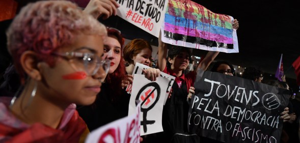Demonstrators take part in a protest against Brazilian right-wing presidential candidate Jair Bolsonaro in Sao Paulo, Brazil, on October 10 2018. - The populist ultra-conservative won 46 percent of the vote in the first round, despite detractors highlighting his contentious past comments demeaning women and gays, and speaking in favor of torture and Brazil's 1964-1985 military dictatorship. Brazil will hold the run-off presidential election next October 28. (Photo by NELSON ALMEIDA / AFP) (Photo credit should read NELSON ALMEIDA/AFP/Getty Images)