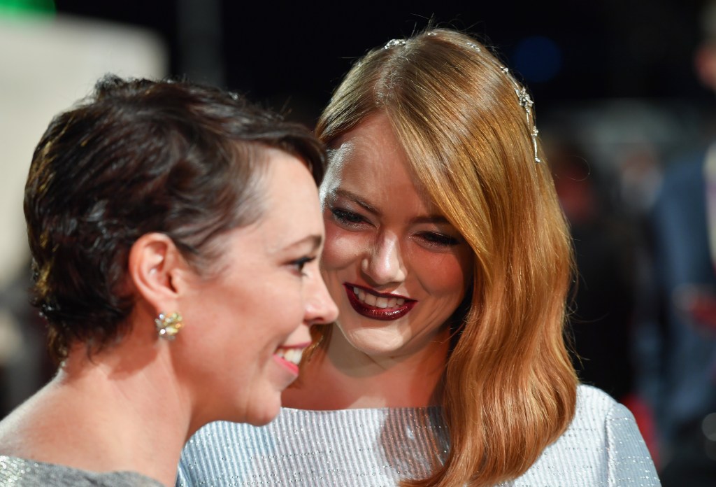 Olivia Colman and Emma Stone attend the UK Premiere of "The Favourite," the movie in which the two act in a sex scene.