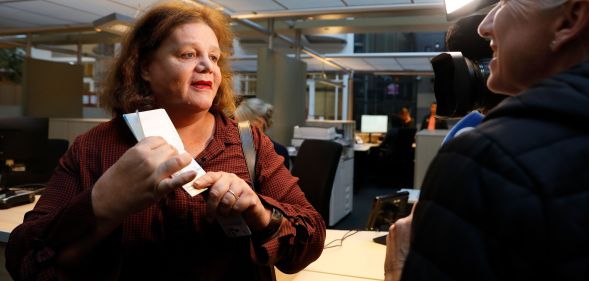 Leonne Zeegers, 57, receives a passeport with the gender designation X, instead of M for man or V for woman in Breda, on October 19, 2018. - The first gender-neutral passport of The Netherlands was issued. (Photo by Bas Czerwinski / ANP / AFP) / Netherlands OUT (Photo credit should read BAS CZERWINSKI/AFP/Getty Images)