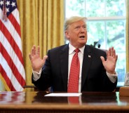 WASHINGTON, DC - OCTOBER 17: U.S. President Donald Trump talks to reporters while hosting workers and members of his cabinet for a meeting in the Oval Office at the White House October 17, 2018 in Washington, DC. The White House said the meeting was on “Cutting the Red Tape, Unleashing Economic Freedom." (Photo by Chip Somodevilla/Getty Images)