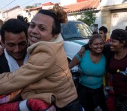 LGBT asylum seekers celebrate their arrival at the US-Mexico border.