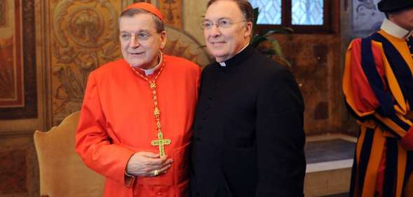 Newly appointed cardinal, US Raymond leo Burke (L) poses with a member of the clergy during the traditionnal courtesy visit after the consistory on November 20, 2010 at The Vatican. 24 Roman Catholic prelates joined the Vatican's College of Cardinals, the elite body that advises the pontiff and elects his successor upon his death. AFP PHOTO / ALBERTO PIZZOLI (Photo credit should read ALBERTO PIZZOLI/AFP/Getty Images)