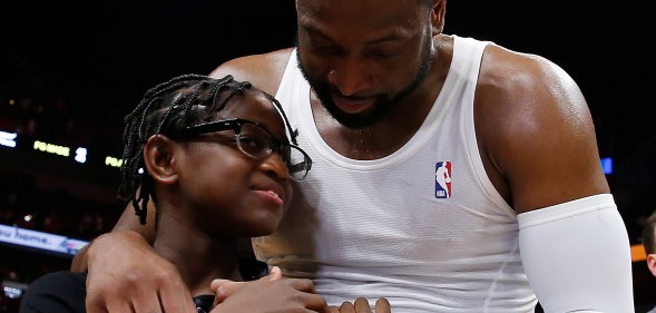 Dwyane Wade hugs his son Zion