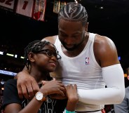 Dwyane Wade hugs his son Zion