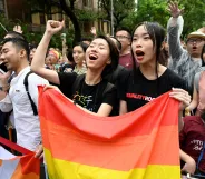 Supporters of same-sex marriage celebrate outside the parliament in Taipei on May 17, 2019. - Taiwan's parliament legalised same-sex marriage on May 17, 2019, in a landmark first for Asia as the government survived a last-minute attempt by conservatives to pass watered-down legislation.
