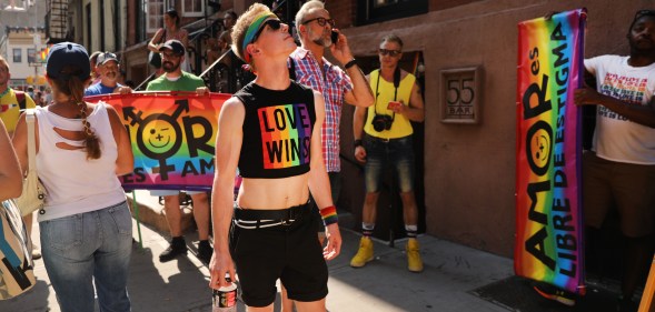 People gather outside Stonewall Inn for rally.