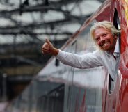 British entrepreneur Sir Richard Branson leans out of the window of the driver's cab on board a Virgin Pendolino train at Lime Street Station in Liverpool, north-west England, on March 13, 2012, as he prepares to launch a Global Entrepreneurship Congress. The event aims to be the largest gathering of start-up champions from around the world. AFP PHOTO/PAUL ELLIS (Photo credit should read PAUL ELLIS/AFP/Getty Images)