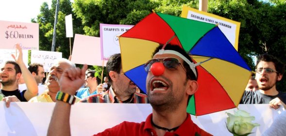 Lebanese demonstrators shout slogans during the Laique Pride III march, calling for equality amongst all Lebanese citizens in Beirut on May 6, 2012. The Laique Pride encourages and supports every movement and organization working towards a more egalitarian society and seeks to inspire new citizen initiatives in Lebanon. AFP PHOTO / ANWAR AMRO (Photo credit should read ANWAR AMRO/AFP/GettyImages)