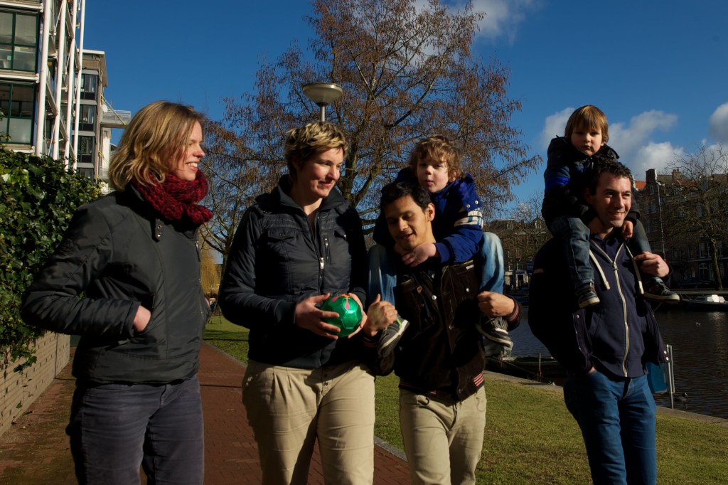 Dutch gay couples walk with their children in the Netherlands.