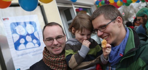 BERLIN, GERMANY - MARCH 15: Gay couple Kai (L) and Michael Korok and their daughter Jana, 4, attend the opening of Germany's first gay parent counseling center on March 15, 2013 in Berlin, Germany. The Regenbogenfamilien Zentrum (Rainbow Families Center) will provide counseling and other services to families with gay, lesbian and transgender parents. Gay marriage is legal in Germany though gay couples are not entitled to the same full legal rights as heterosexual couples, and the issue of child adoption by gay couples remains legally somewhat complicated. (Photo by Sean Gallup/Getty Images)