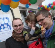 BERLIN, GERMANY - MARCH 15: Gay couple Kai (L) and Michael Korok and their daughter Jana, 4, attend the opening of Germany's first gay parent counseling center on March 15, 2013 in Berlin, Germany. The Regenbogenfamilien Zentrum (Rainbow Families Center) will provide counseling and other services to families with gay, lesbian and transgender parents. Gay marriage is legal in Germany though gay couples are not entitled to the same full legal rights as heterosexual couples, and the issue of child adoption by gay couples remains legally somewhat complicated. (Photo by Sean Gallup/Getty Images)