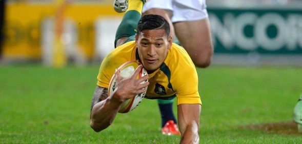 BRISBANE, AUSTRALIA - JUNE 22: Israel Folau of the Wallabies scores a try during the First Test match between the Australian Wallabies and the British & Irish Lions at Suncorp Stadium on June 22, 2013 in Brisbane, Australia. (Photo by Bradley Kanaris/Getty Images)