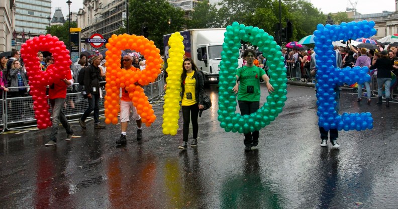 People take part in the Pride in London march in 2014, which celebrates those identifying as part of the LGBT acronym and their allies.