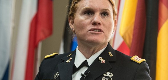 Transgender US Army Reseve Captain Sage Fox speaks during a conference entitled "Perspectives on Transgender Military Service from Around the Globe" organized by the American Civil Liberties Union (ACLU) and the Palm Center in Washington on October 20, 2014. Transgender military personnel from 18 countries who allow them to serve openly, gathered to talk about their experiences and discuss whether the US military could join them. After Separtating from the military as a man, Fox legally changed her gender, and was invited to join the reserves as a woman. AFP PHOTO/Nicholas KAMM (Photo credit should read NICHOLAS KAMM/AFP/Getty Images)