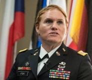 Transgender US Army Reseve Captain Sage Fox speaks during a conference entitled "Perspectives on Transgender Military Service from Around the Globe" organized by the American Civil Liberties Union (ACLU) and the Palm Center in Washington on October 20, 2014. Transgender military personnel from 18 countries who allow them to serve openly, gathered to talk about their experiences and discuss whether the US military could join them. After Separtating from the military as a man, Fox legally changed her gender, and was invited to join the reserves as a woman. AFP PHOTO/Nicholas KAMM (Photo credit should read NICHOLAS KAMM/AFP/Getty Images)