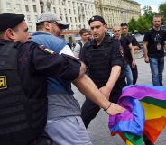 Russian riot policemen detain a gay and LGBT rights activist during an unauthorized gay rights activists rally in central Moscow on May 30, 2015. Moscow city authorities turned down demands for a gay rights rally. AFP PHOTO/DMITRY SEREBRYAKOV (Photo credit should read DMITRY SEREBRYAKOV/AFP/Getty Images)
