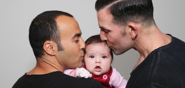 SYDNEY, AUSTRALIA - MAY 30: (L-R) Sydney couple, Faycal Dow, aged 38, daughter Myla Dow, aged 2 months, and Hunter Dow, aged 44, pose during a portrait session on May 30, 2015 in Sydney, Australia. Faycal and Hunter were legally married in France last year and had their first child Myla this year and are supporters of same-sex marriage. " For the sake of our daughter more than anything, it is important that our marriage is recognised as valid in Australia, the country we live in and hope to bring our beautiful daughter up in", said Hunter. The marriage equality debate in Australia has reignited on the back of Ireland's referendum legalising same-sex marriage last week. Recent polls suggest public support for gay marriage in Australia is at an all-time high of 72%. (Photo by Don Arnold/Getty Images)