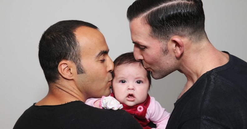 SYDNEY, AUSTRALIA - MAY 30: (L-R) Sydney couple, Faycal Dow, aged 38, daughter Myla Dow, aged 2 months, and Hunter Dow, aged 44, pose during a portrait session on May 30, 2015 in Sydney, Australia. Faycal and Hunter were legally married in France last year and had their first child Myla this year and are supporters of same-sex marriage. " For the sake of our daughter more than anything, it is important that our marriage is recognised as valid in Australia, the country we live in and hope to bring our beautiful daughter up in", said Hunter. The marriage equality debate in Australia has reignited on the back of Ireland's referendum legalising same-sex marriage last week. Recent polls suggest public support for gay marriage in Australia is at an all-time high of 72%. (Photo by Don Arnold/Getty Images)