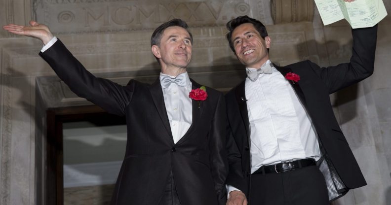 LONDON, ENGLAND - MARCH 29: Gay couple Peter McGraith and David Cabreza leave Islington Town Hall after being married shortly after midnight in one of the UK's first same-sex weddings on March 29, 2014 in London, England. Same sex couples have been able to enter into 'civil partnerships' since 2005, however following a change in the law in July 2013 gay couples are now eligible to marry in England and Wales. A number of gay couples have arranged for their wedding ceremonies to take place shortly after midnight on March 29, 2014 to become some of the first to take advantage of the new law. Parliament's decision to grant same sex couples an equal right to marriage has been met with opposition from religious groups. Gay marriage is currently being debated in Scotland, however the Northern Ireland administration has no plans to make it law. (Photo by Rob Stothard/Getty Images)