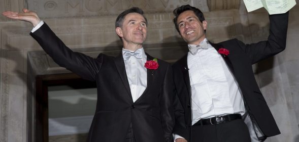 LONDON, ENGLAND - MARCH 29: Gay couple Peter McGraith and David Cabreza leave Islington Town Hall after being married shortly after midnight in one of the UK's first same-sex weddings on March 29, 2014 in London, England. Same sex couples have been able to enter into 'civil partnerships' since 2005, however following a change in the law in July 2013 gay couples are now eligible to marry in England and Wales. A number of gay couples have arranged for their wedding ceremonies to take place shortly after midnight on March 29, 2014 to become some of the first to take advantage of the new law. Parliament's decision to grant same sex couples an equal right to marriage has been met with opposition from religious groups. Gay marriage is currently being debated in Scotland, however the Northern Ireland administration has no plans to make it law. (Photo by Rob Stothard/Getty Images)